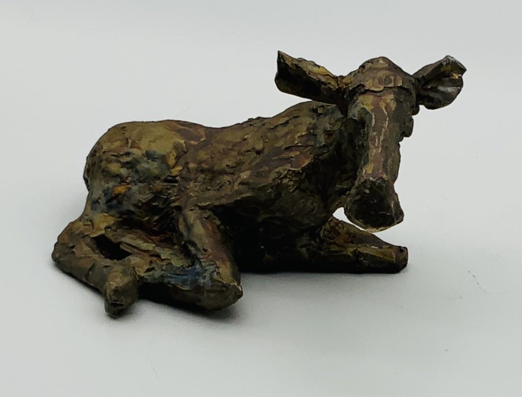 Moose laying down in bronze